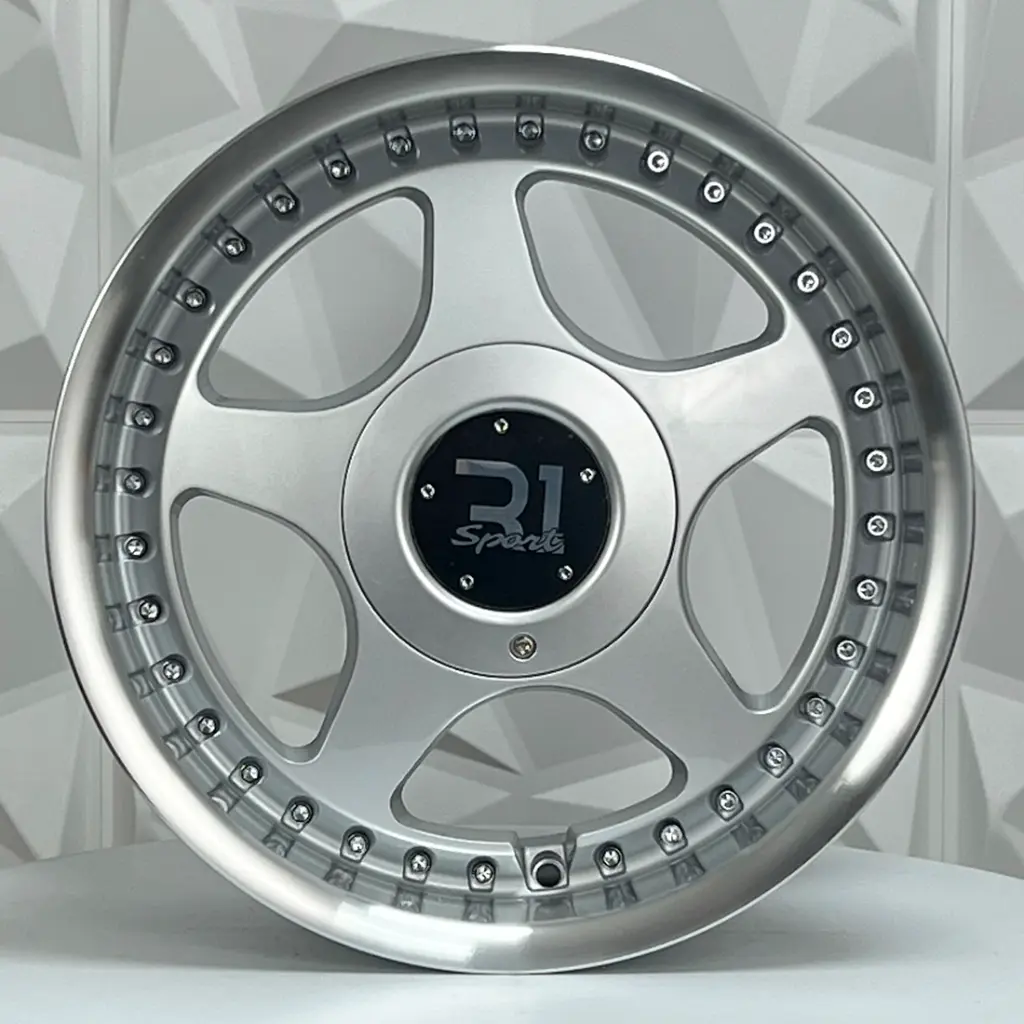 RIN 15X7 4-100/114.3 R1 SPORT HX085B SILVER MACHINE LIP+CHROME RIVETS ET35 CB73.